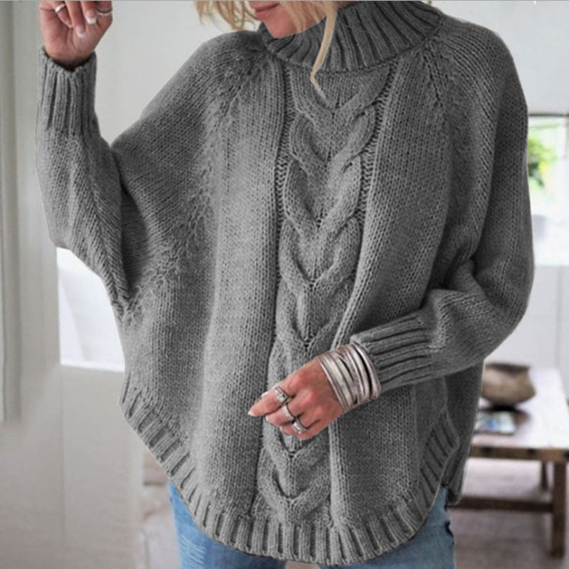 Elegant poncho-inspireret trøje
