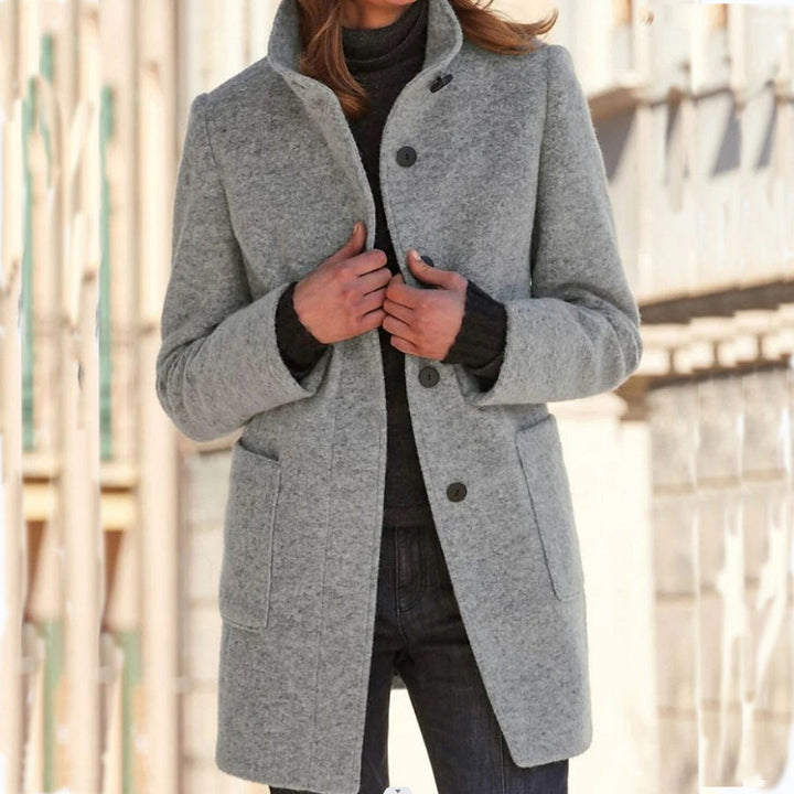 Elegant lang frakke med knapper